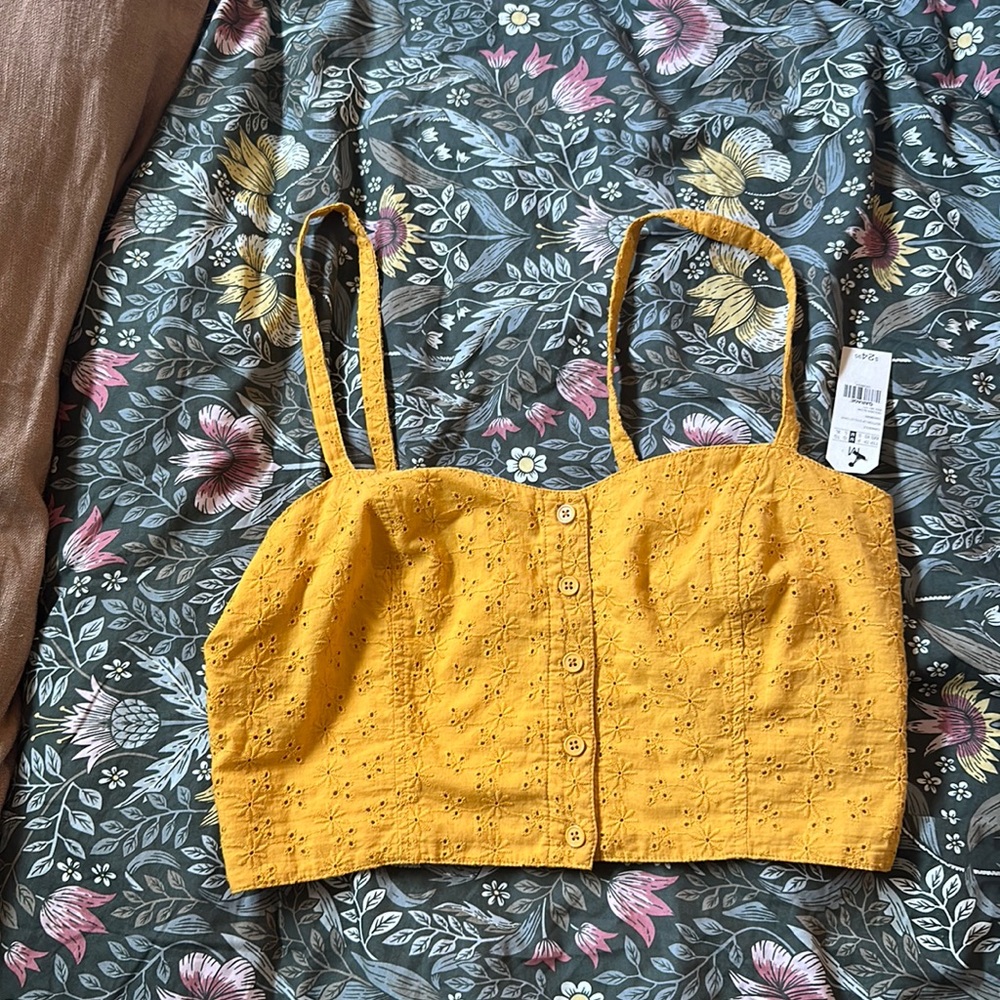 crop top. Mustard color. Cute eyelet design. Stretchy back. Super cute.